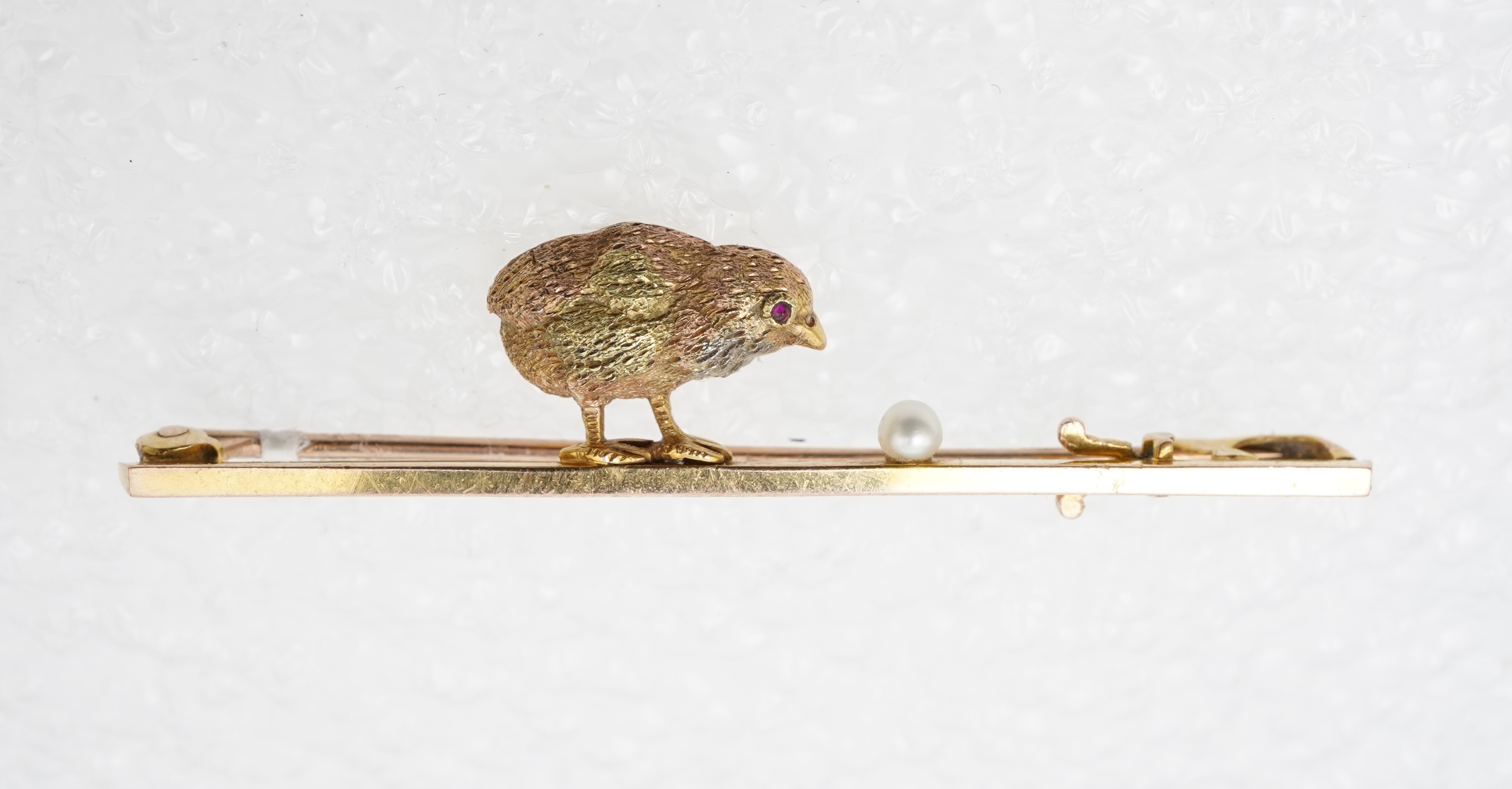 A gold and seed pearl novelty bar brooch, circa 1900